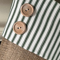 Closeup detail of green ticking cuff, burlap fabric, and the two hand sewn wood buttons. Made by BurlapBabe.
